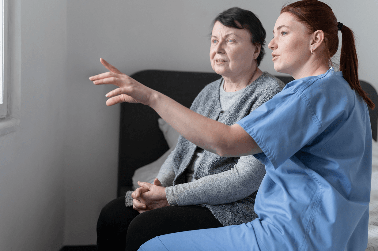 Caregiver and client in a warm, supportive home setting